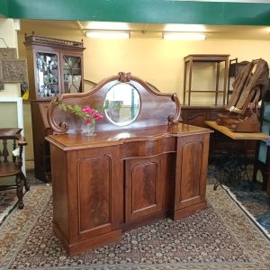 Semi -Serpy Mahogany Chiffonier